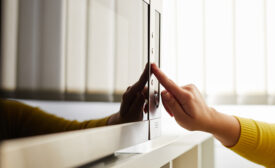 Woman using a microwave in the office