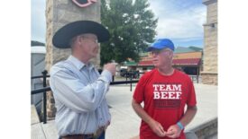 Eric Jennings, local beef producer, visits with Team Beef cyclist