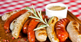 Grilled assorted sausages with spices and rosemary