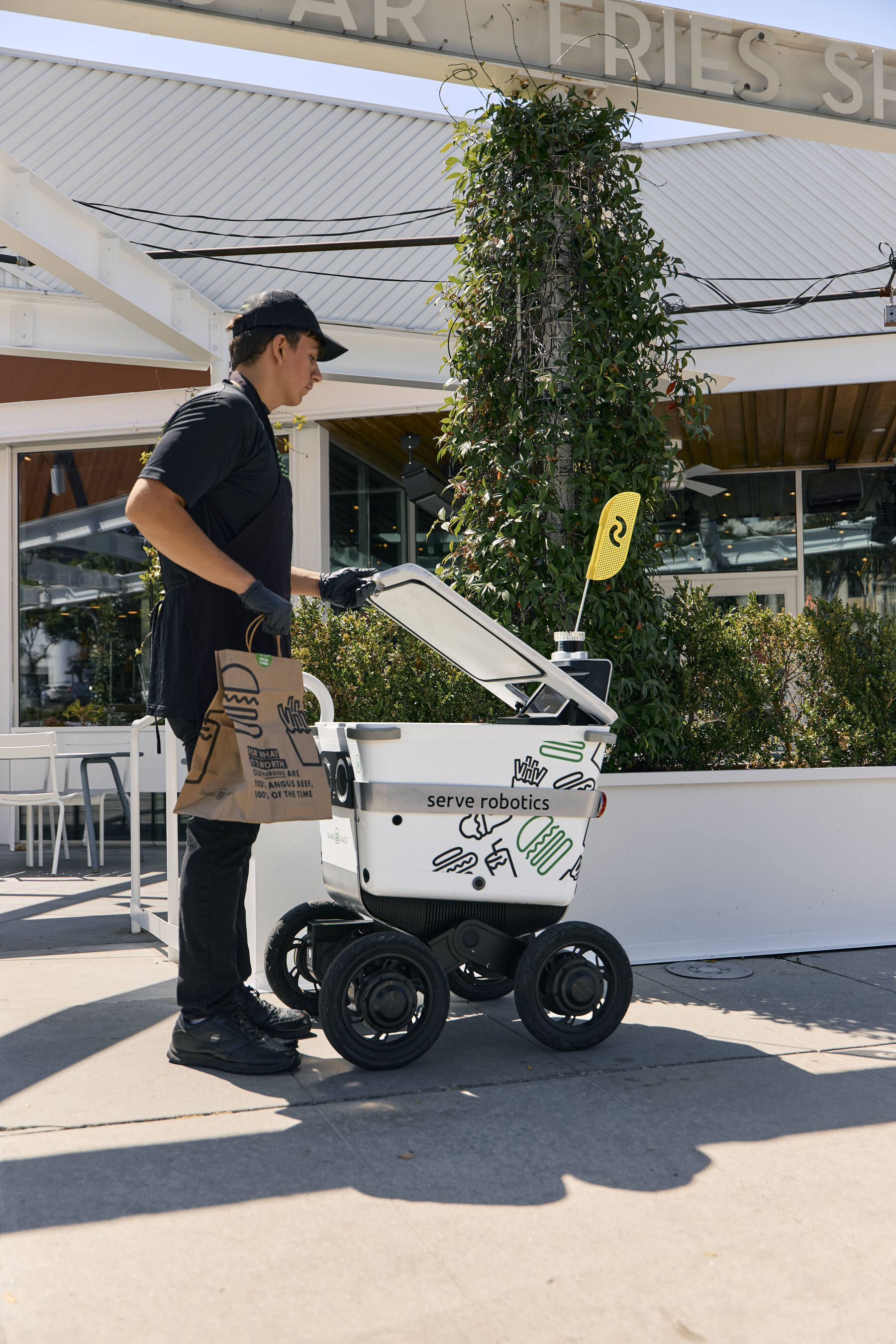 Serve Robotics robot delivering for Shake Shack