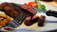 Piece of steak on a fork