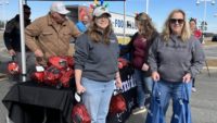 Smithfield Foods employees distribute free hams