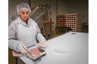 employee weighing meat